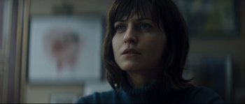 Movie still from “Empire of the Wolves” (2005), directed by Chris Nahon – A person looking at the camera; Close Up shot, Over the shoulder angle