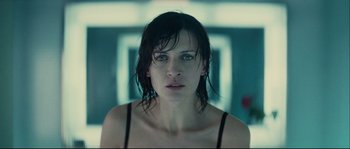 Movie still from “Empire of the Wolves” (2005), directed by Chris Nahon – A person with wet hair; Close Up shot, Low angle