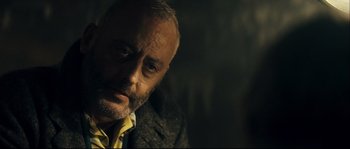 Movie still from “Empire of the Wolves” (2005), directed by Chris Nahon – A person wearing a jacket; Close Up shot, Over the shoulder angle