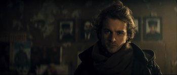 Movie still from “Empire of the Wolves” (2005), directed by Chris Nahon – A person with long hair; Close Up shot, Over the shoulder angle