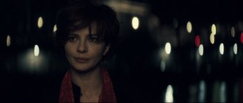 Movie still from “Empire of the Wolves” (2005), directed by Chris Nahon – A person with short hair; Close Up shot, Over the shoulder angle