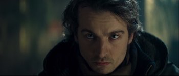Movie still from “Empire of the Wolves” (2005), directed by Chris Nahon – A person looking at the camera; Close Up shot, Over the shoulder angle