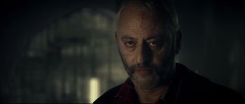 Movie still from “Empire of the Wolves” (2005), directed by Chris Nahon – A person with a beard; Close Up shot, Over the shoulder angle