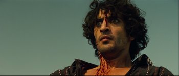 Movie still from “Empire of the Wolves” (2005), directed by Chris Nahon – A person with blood on his face; Close Up shot, Low angle