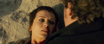 Movie still from “Empire of the Wolves” (2005), directed by Chris Nahon – A woman with blood all over her face; Close Up shot, Over the shoulder angle