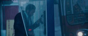 Movie still from “The Pursuit of Happyness” (2006), created by Frank Darabont – A man standing in front of a glass window; Medium shot, Over the shoulder angle