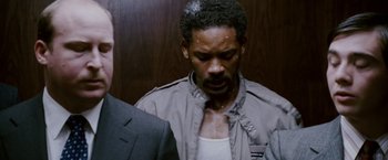 Movie still from “The Pursuit of Happyness” (2006), created by Frank Darabont – A person wearing a jacket; Close Up shot, Low angle
