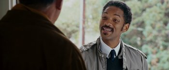 Movie still from “The Pursuit of Happyness” (2006), created by Frank Darabont – Two men talking to each other while wearing ties; Close Up shot, Over the shoulder angle