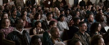 Movie still from “The Pursuit of Happyness” (2006), created by Frank Darabont – A group of people sitting in a room; Wide shot, High angle