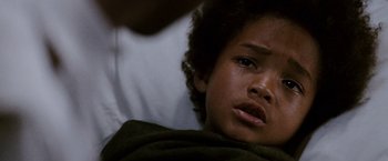 Movie still from “The Pursuit of Happyness” (2006), created by Frank Darabont – A young child's face; Close Up shot, High angle