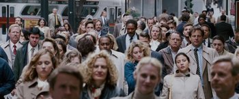 Movie still from “The Pursuit of Happyness” (2006), created by Frank Darabont – A crowd of people walking down a street; Wide shot, High angle