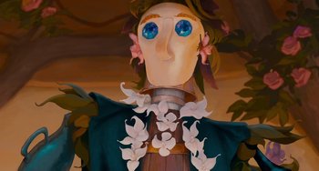 Movie still from “Enchanted” (2007), directed by Kevin Lima – A doll with flowers around it; Close Up shot, Low angle