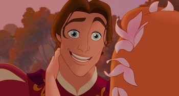 Movie still from “Enchanted” (2007), directed by Kevin Lima – A man smiling for the camera; Close Up shot, Over the shoulder angle