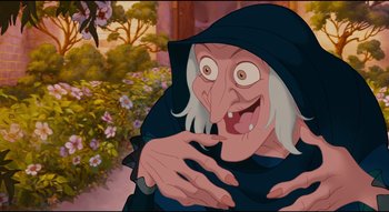 Movie still from “Enchanted” (2007), directed by Kevin Lima – An old woman with long white hair and a black hood; Close Up shot, Low angle