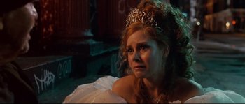 Movie still from “Enchanted” (2007), directed by Kevin Lima – A woman in a white dress and a tiara; Close Up shot, Over the shoulder angle