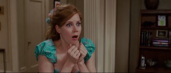 Movie still from “Enchanted” (2007), directed by Kevin Lima – A woman with a surprised look on her face; Close Up shot, Over the shoulder angle