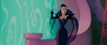 Movie still from “Enchanted” (2007), directed by Kevin Lima – A woman dressed in a black dress with a cat on her arm; Medium shot, Low angle