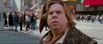 Movie still from “Enchanted” (2007), directed by Kevin Lima – A person wearing a hat; Close Up shot, Over the shoulder angle