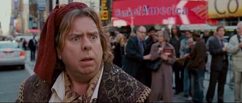 Movie still from “Enchanted” (2007), directed by Kevin Lima – A person with a crowd of people in the background; Close Up shot, Over the shoulder angle