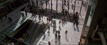Movie still from “Enchanted” (2007), directed by Kevin Lima – A group of people walking around a building; Extreme Wide shot, High angle