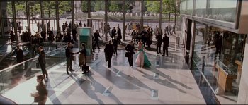 Movie still from “Enchanted” (2007), directed by Kevin Lima – A group of people walking around a building; Extreme Wide shot, High angle