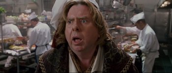 Movie still from “Enchanted” (2007), directed by Kevin Lima – A person with a hat on head; Close Up shot, Over the shoulder angle