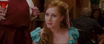 Movie still from “Enchanted” (2007), directed by Kevin Lima – A beautiful young woman with long red hair and blue eyes; Close Up shot, Over the shoulder angle