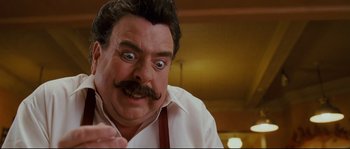 Movie still from “Enchanted” (2007), directed by Kevin Lima – A person with a mustache; Close Up shot, Low angle