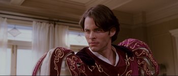 Movie still from “Enchanted” (2007), directed by Kevin Lima – A person wearing a costume; Close Up shot, Over the shoulder angle