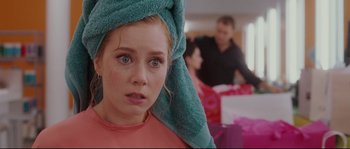 Movie still from “Enchanted” (2007), directed by Kevin Lima – A woman with a towel on her head; Close Up shot, Over the shoulder angle