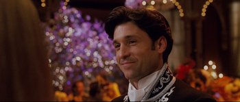 Movie still from “Enchanted” (2007), directed by Kevin Lima – A man that is wearing a neck scarf; Close Up shot, Over the shoulder angle