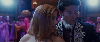 Movie still from “Enchanted” (2007), directed by Kevin Lima – A man and a woman in formal attire; Close Up shot, Over the shoulder angle
