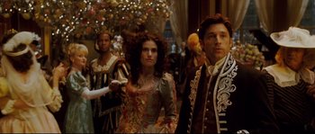Movie still from “Enchanted” (2007), directed by Kevin Lima – A group of people dressed in medieval costumes; Medium shot, Over the shoulder angle