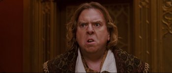 Movie still from “Enchanted” (2007), directed by Kevin Lima – A person with long blonde hair; Close Up shot, Low angle