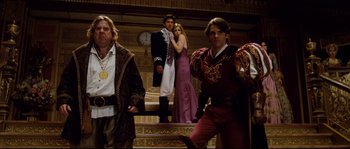 Movie still from “Enchanted” (2007), directed by Kevin Lima – A group of people standing on top of a wooden stage; Wide shot, Low angle