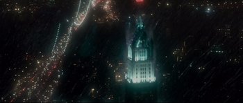 Movie still from “Enchanted” (2007), directed by Kevin Lima – An aerial view of a building lit up at night; Extreme Wide shot, High angle