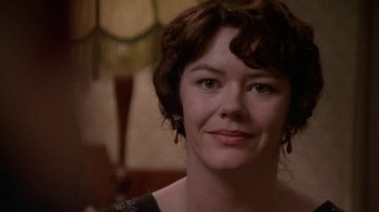 Movie still from “Enchanted April” (1991), directed by Mike Newell – A person wearing a dress; Close Up shot, Over the shoulder angle