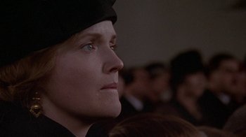 Movie still from “Enchanted April” (1991), directed by Mike Newell – A person wearing a hat; Close Up shot, Low angle