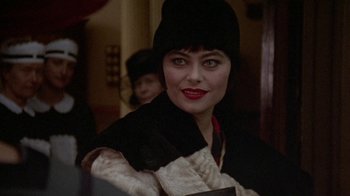Movie still from “Enchanted April” (1991), directed by Mike Newell – A person wearing a hat; Close Up shot, Over the shoulder angle