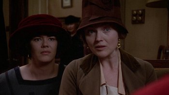 Movie still from “Enchanted April” (1991), directed by Mike Newell – Two women wearing hats in a room; Close Up shot, Low angle