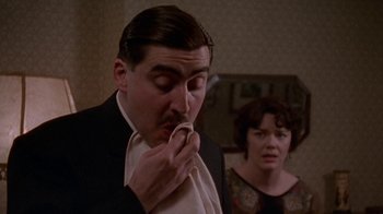 Movie still from “Enchanted April” (1991), directed by Mike Newell – A man and a woman are eating a sandwich; Close Up shot, Low angle