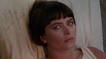 Movie still from “Enchanted April” (1991), directed by Mike Newell – A person laying on the ground; Close Up shot, High angle