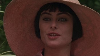Movie still from “Enchanted April” (1991), directed by Mike Newell – A person wearing a hat; Close Up shot, Over the shoulder angle