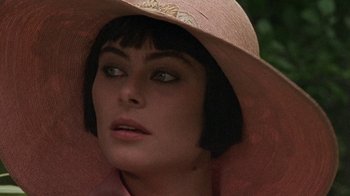 Movie still from “Enchanted April” (1991), directed by Mike Newell – A person wearing a hat; Close Up shot, High angle