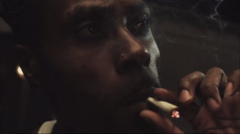 Movie still from “End of Watch” (2012), directed by David Ayer – A person lighting a cigarette; Extreme Close Up shot, Low angle