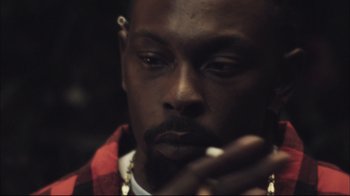 Movie still from “End of Watch” (2012), directed by David Ayer – A person smoking a cigarette; Close Up shot, Low angle