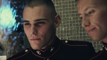 Movie still from “End of Watch” (2012), directed by David Ayer – A person wearing a uniform; Close Up shot, Over the shoulder angle