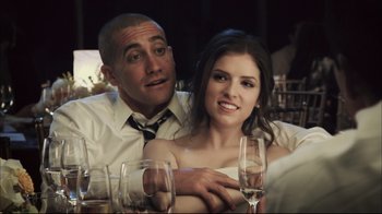 Movie still from “End of Watch” (2012), directed by David Ayer – A man and a woman sitting at a table with wine glasses; Close Up shot, Over the shoulder angle