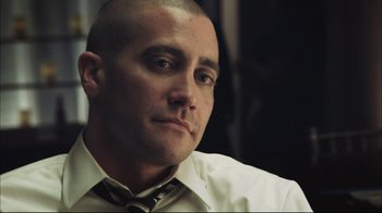 Movie still from “End of Watch” (2012), directed by David Ayer – A man in a white shirt and a black tie; Close Up shot, Over the shoulder angle