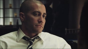 Movie still from “End of Watch” (2012), directed by David Ayer – A man in a white dress shirt and tie; Close Up shot, Over the shoulder angle